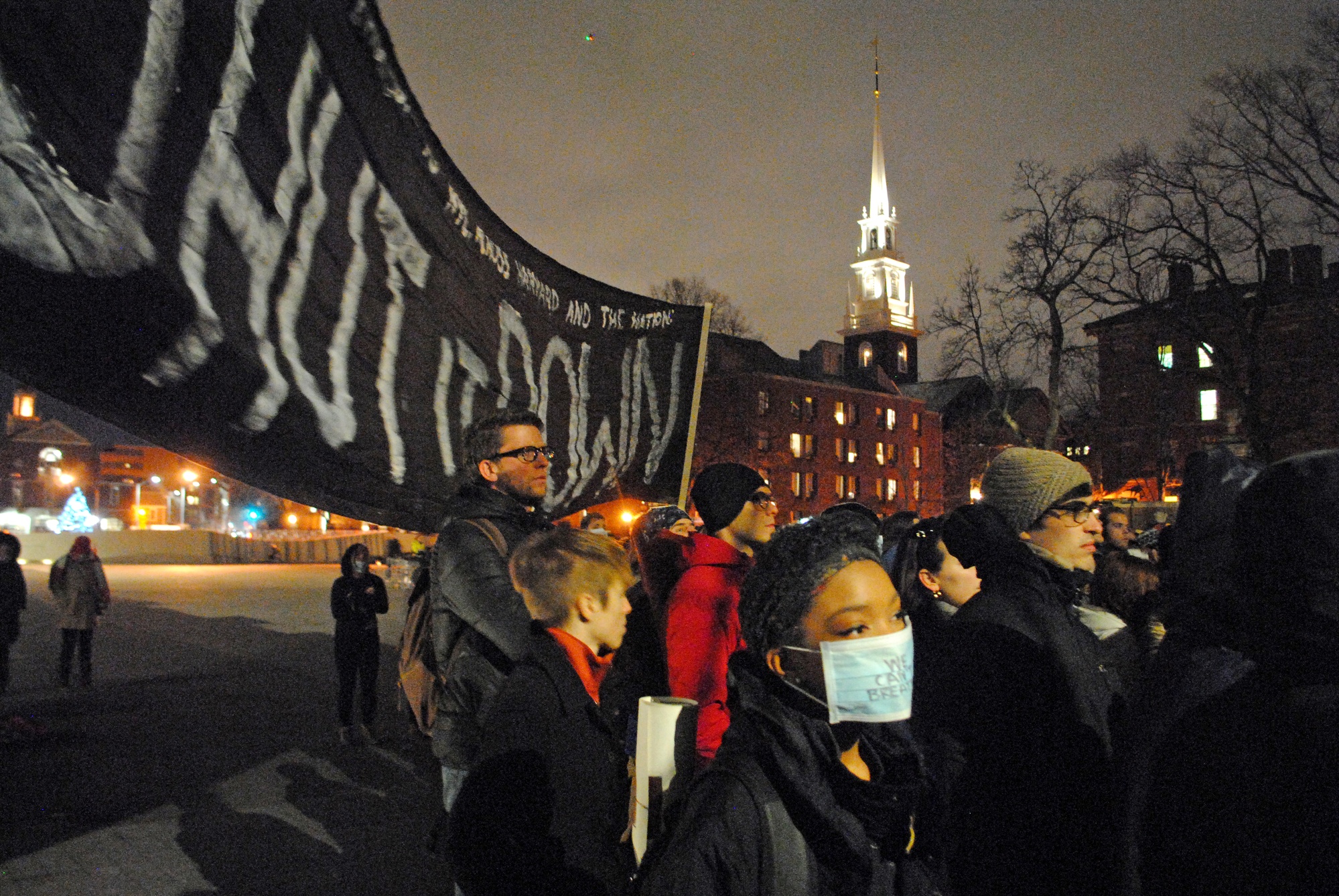 Protesters march from the Science Center Plaza after a rally Friday evening. 