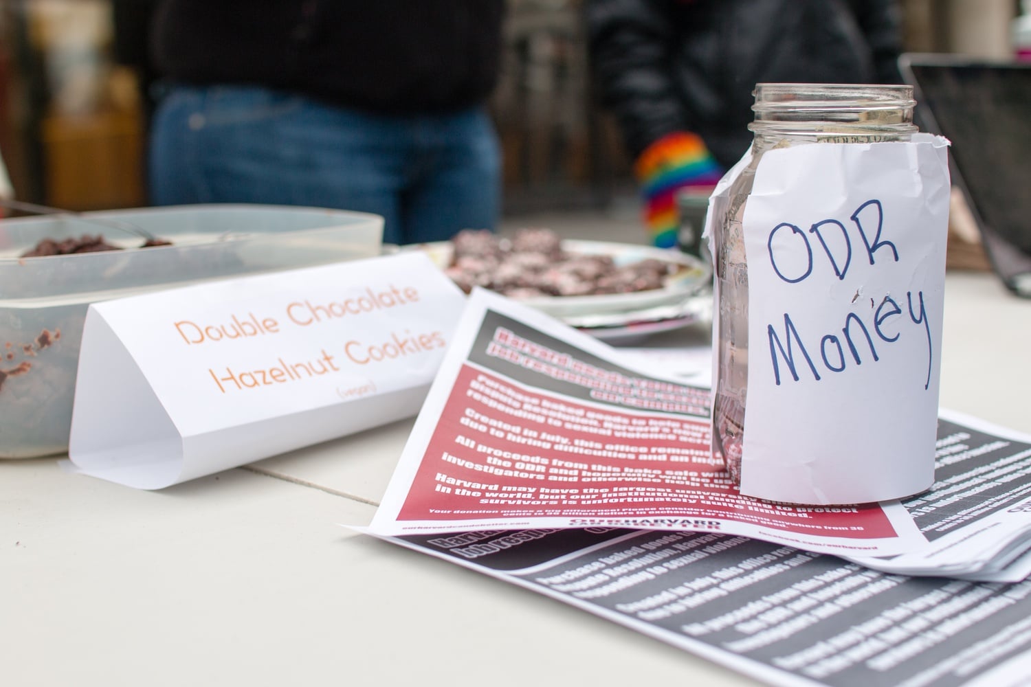 A jar holds bake sale donations for the understaffed Office for Sexual and Gender–Based Dispute Resolution.