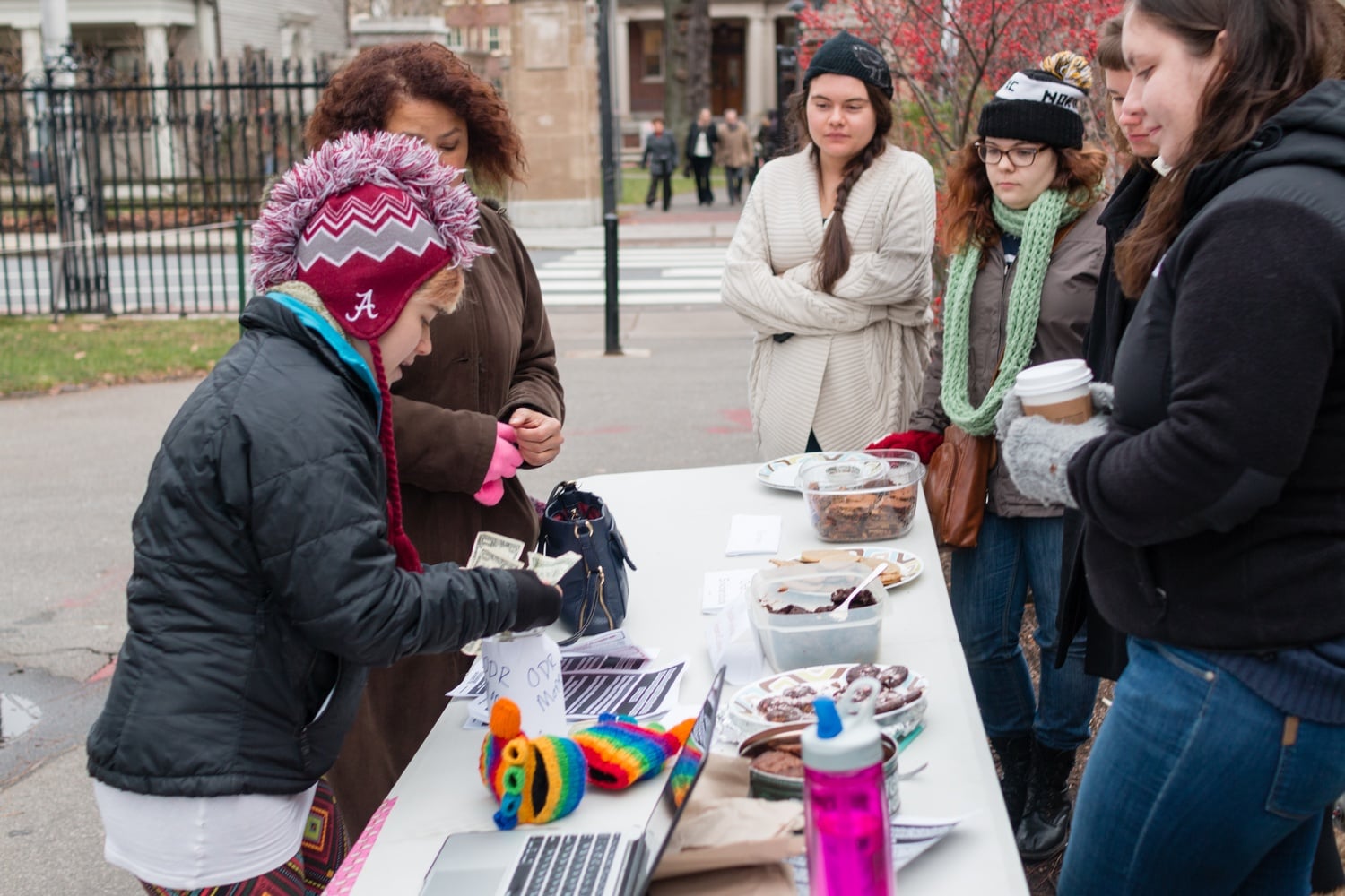 Students man a bake sale in front of Lamont Library on Friday to fund the understaffed Office for Sexual and Gender–Based Dispute Resolution.