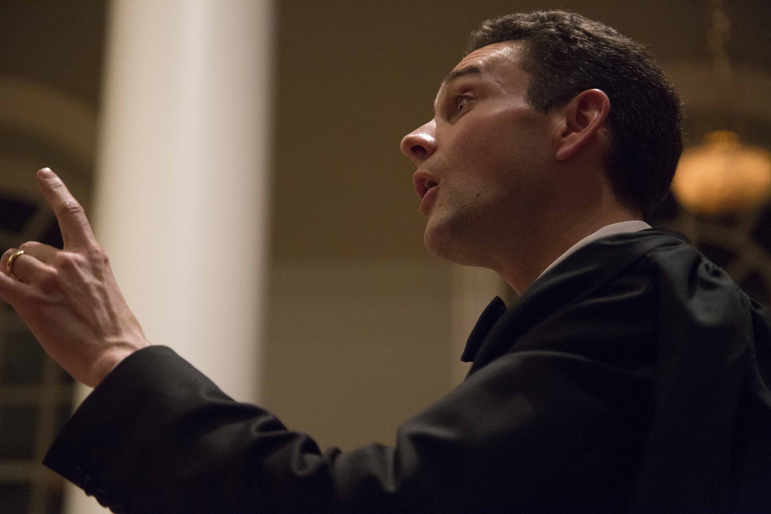 Memorial Church Choirmaster Edward E. Jones conducts the Harvard University Choir as it performs "Silent Night" on Monday evening in Memorial Church. The performance was part of the 105th Annual Christmas Carol Service.