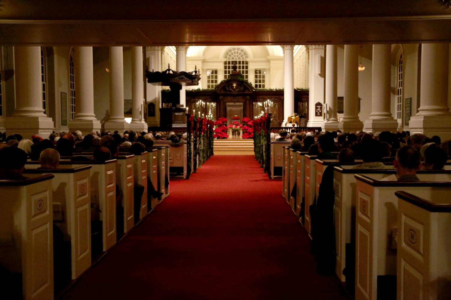 Attendees of all ages gather in Memorial Church for the 105th Annual Christmas Carol Service on Monday evening. According to the event program, the liturgy has remained largely the same as when the carol service began in 1910. 