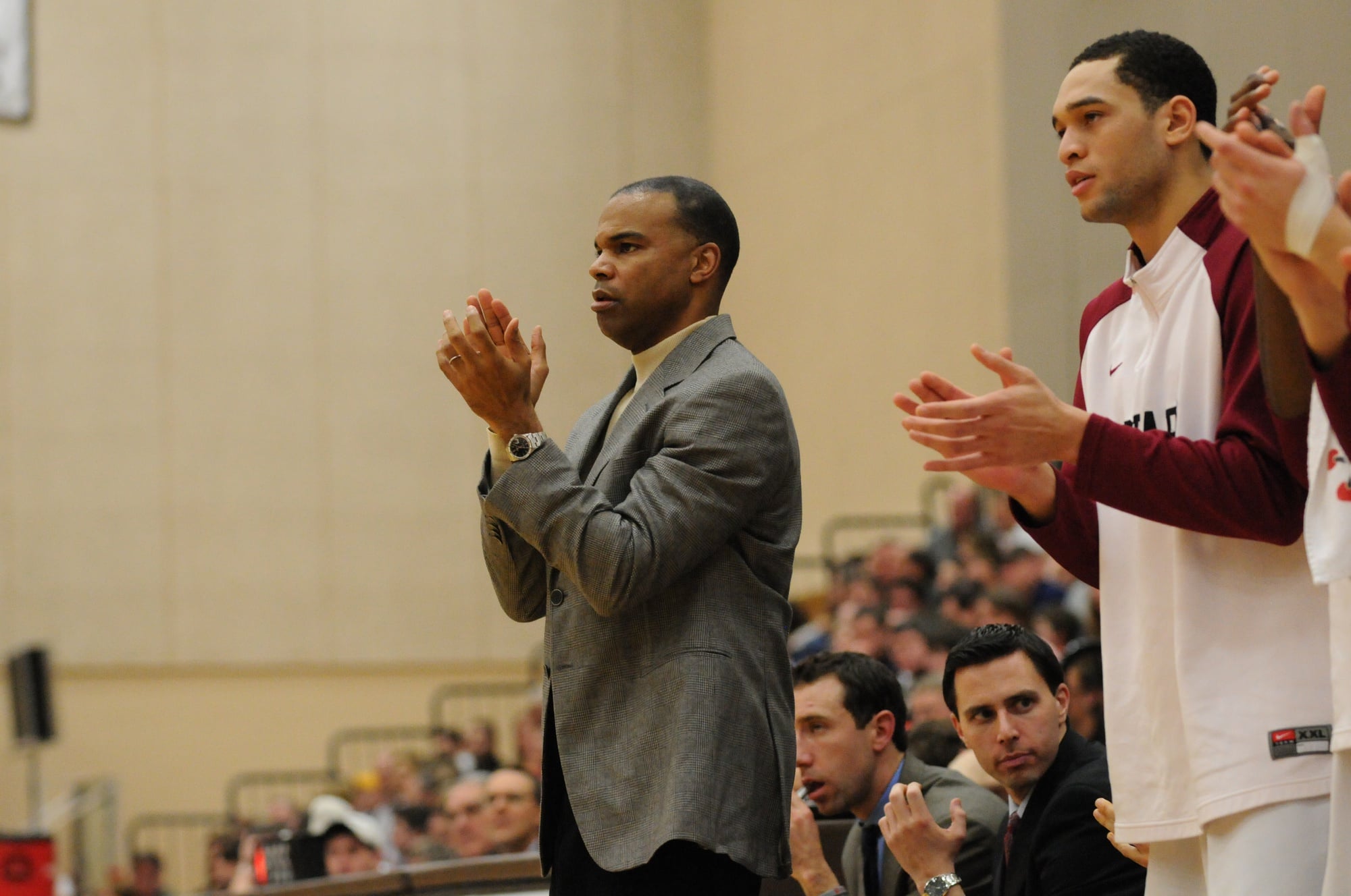 Coach Tommy Amaker claps for his team at a game in 2015.