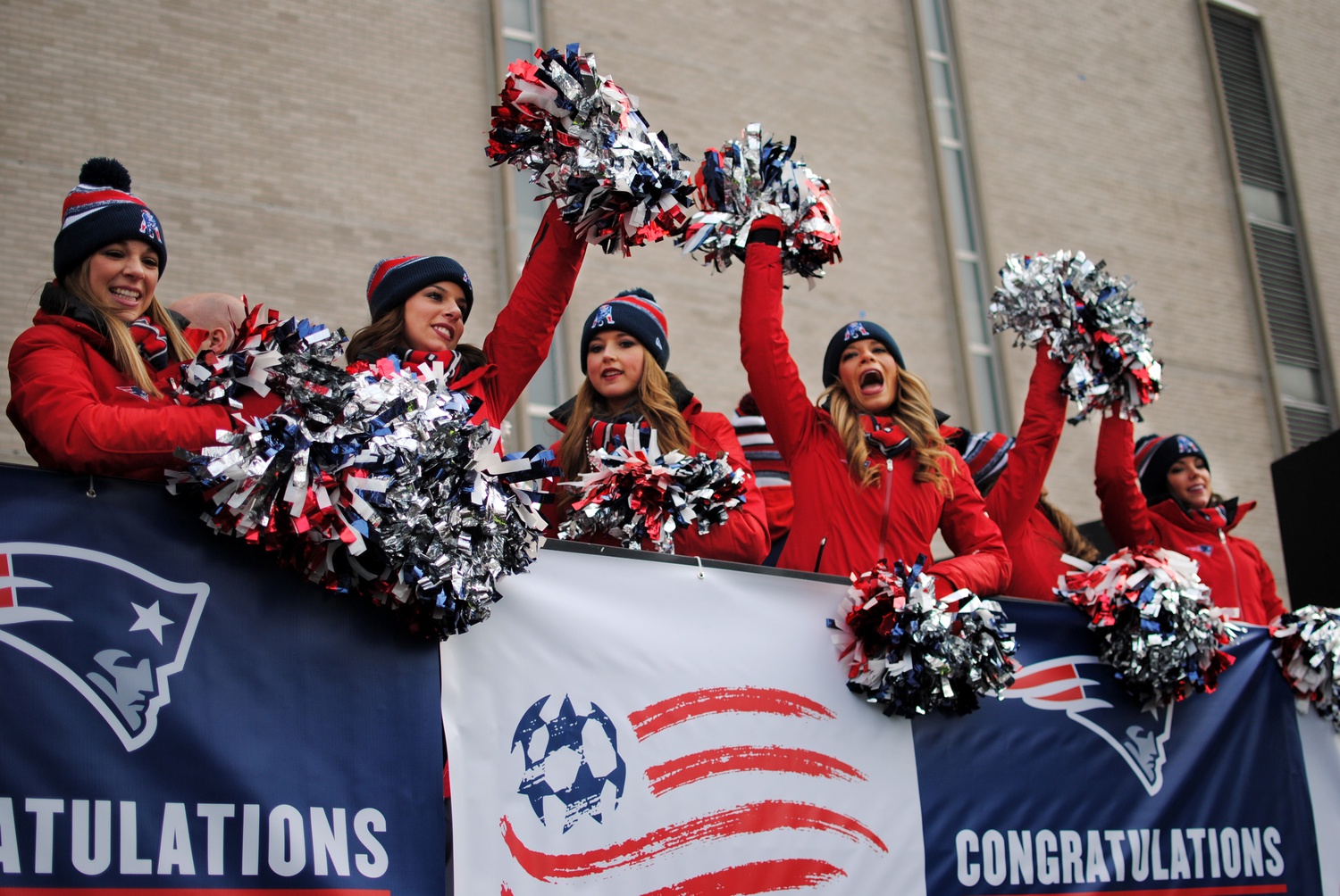 The Patriots cheerleaders celebrate the team's championship win during the Super Bowl parade outside Boston Commons on Wednesday. 