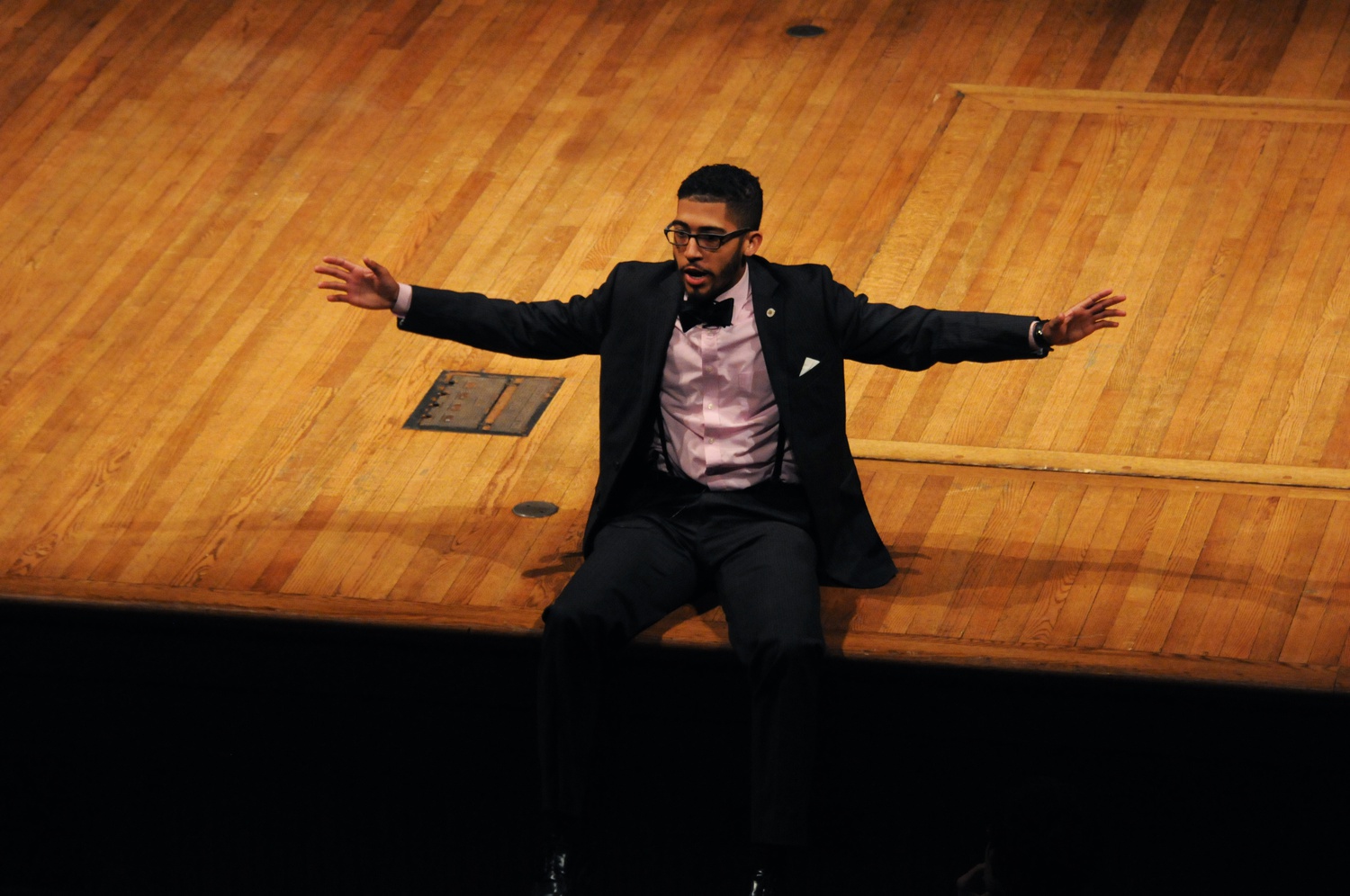 Joshua Scott '15, one of the MCs for the event, introduces the next speaker.