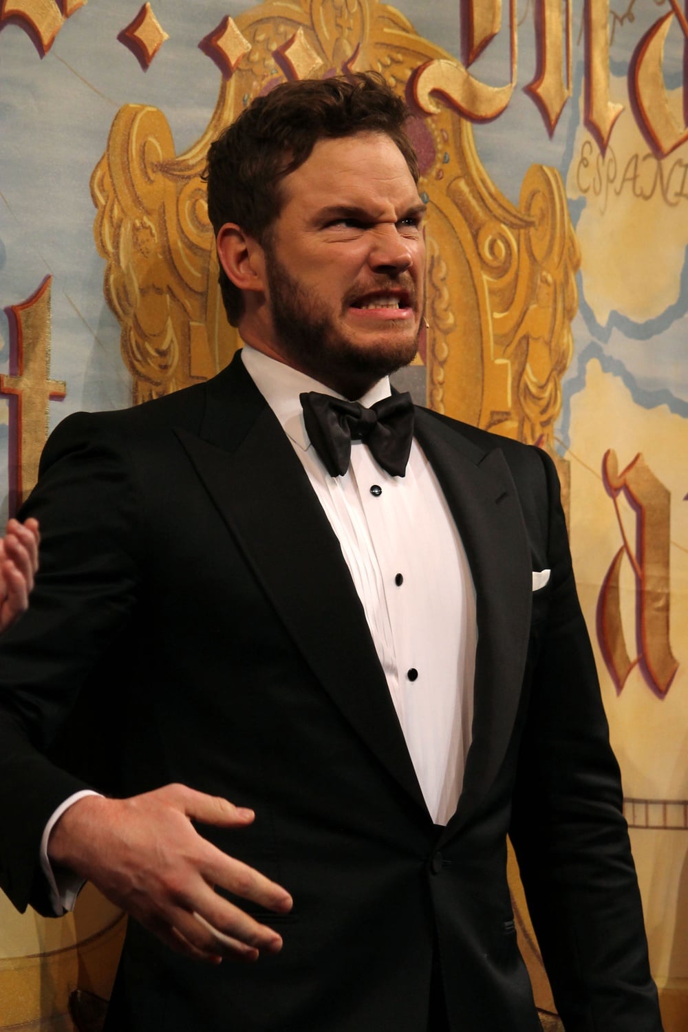 Chris Pratt, Hasty Pudding Theatricals' Man of the Year, winces from the pain of chopping wood with his bare hands at his roast on Friday evening in Farkas Hall. 