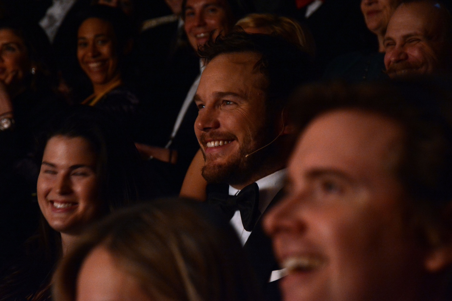 Chris Pratt, Hasty Pudding Theatricals' Man of the Year, appreciates a joke at his roast on Friday evening in Farkas Hall. 
