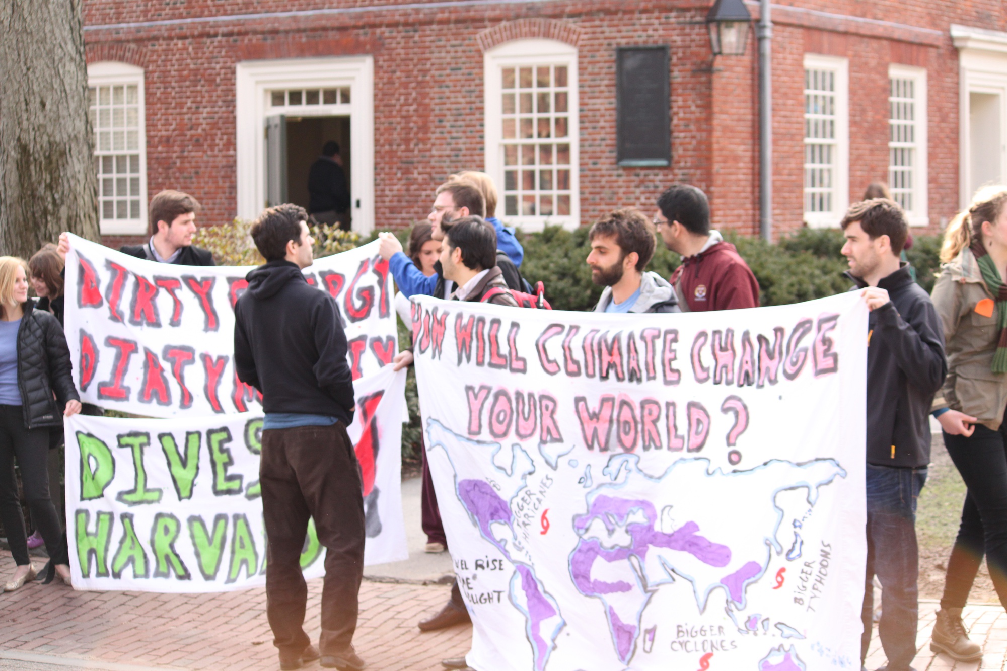 Students assemble outside Massachusetts Hall at a rally in April 2013 to call for Harvard to divest its endowment from fossil fuels. 