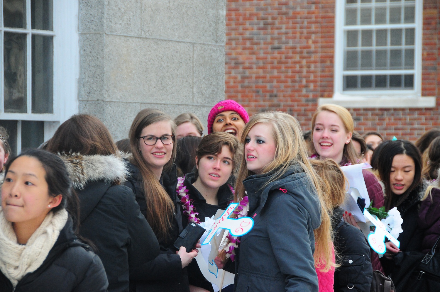New members of sorority Delta Gamma await outside the Sheraton Commander Hotel for pairing instructions. 