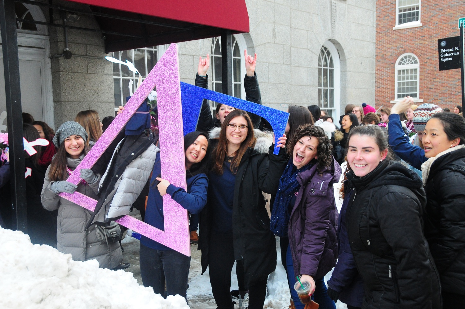 Members of sorority Delta Gamma are excited to greet their new members outside of the Sheraton Commander Hotel Tuesday afternoon after the new members received their bids.