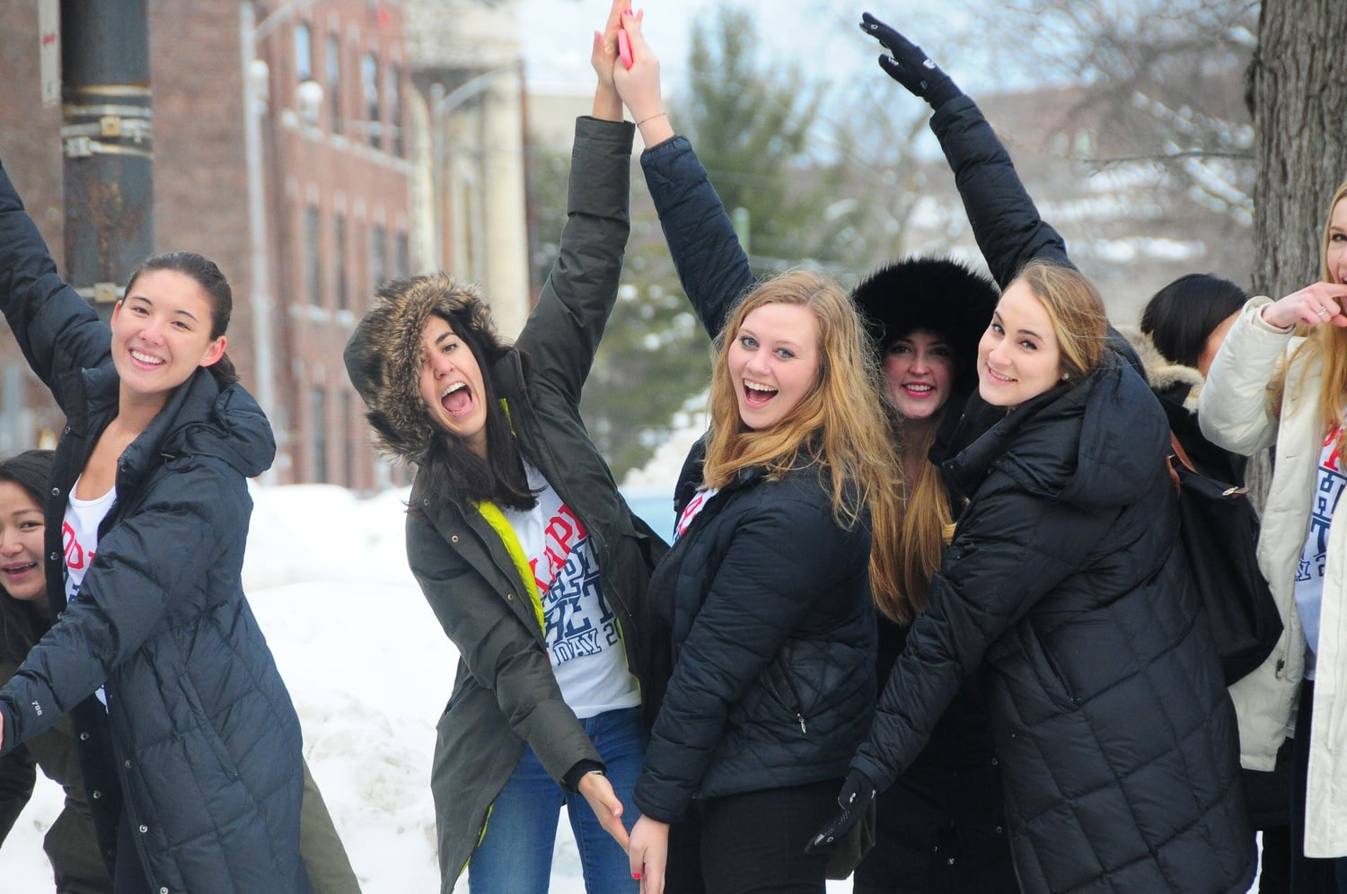 Members of the sorority Kappa Alpha Theta  outside of the Sheraton Commander Hotel as new members of their sororities exit the hotel after receiving their bids. 