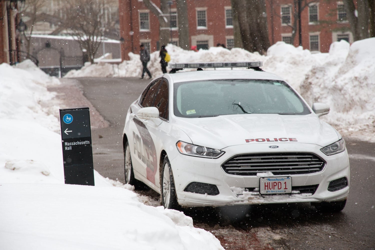A HUPD police cruiser outside Massachusetts Hall, which members of Divest  Harvard occupy as they call for the divestment of the University's endowment from fossil fuels.