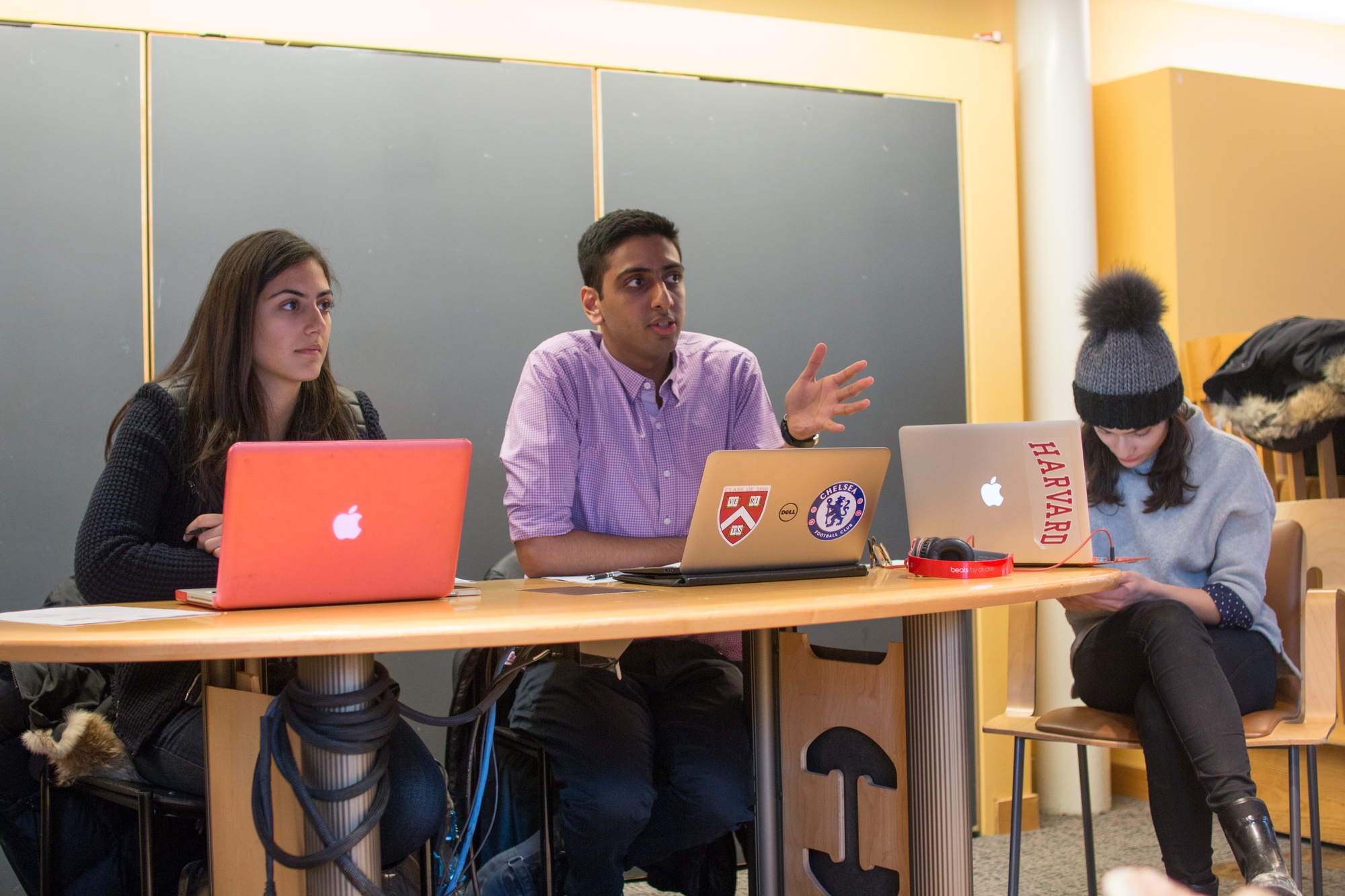 Undergraduate Council President Ava Nasrollahzadeh '16 and Vice President Dhruv P. Goyal '16 speak about the gender solidarity campaign, Harvard HeForShe at the first UC meeting of the year on Feb. 1. 