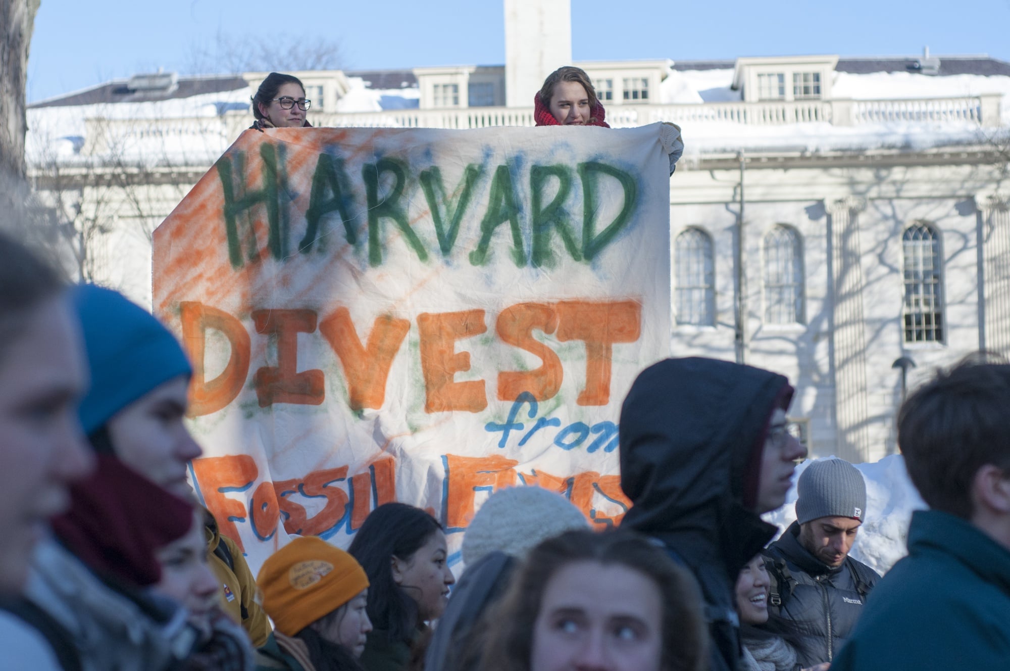 Divest Harvard students rallied to mark Global Divestment Day outside Massachusetts Hall on Friday, Feb. 13, after members of the student group occupied the building, which houses the office of University President Drew G. Faust, the night before.