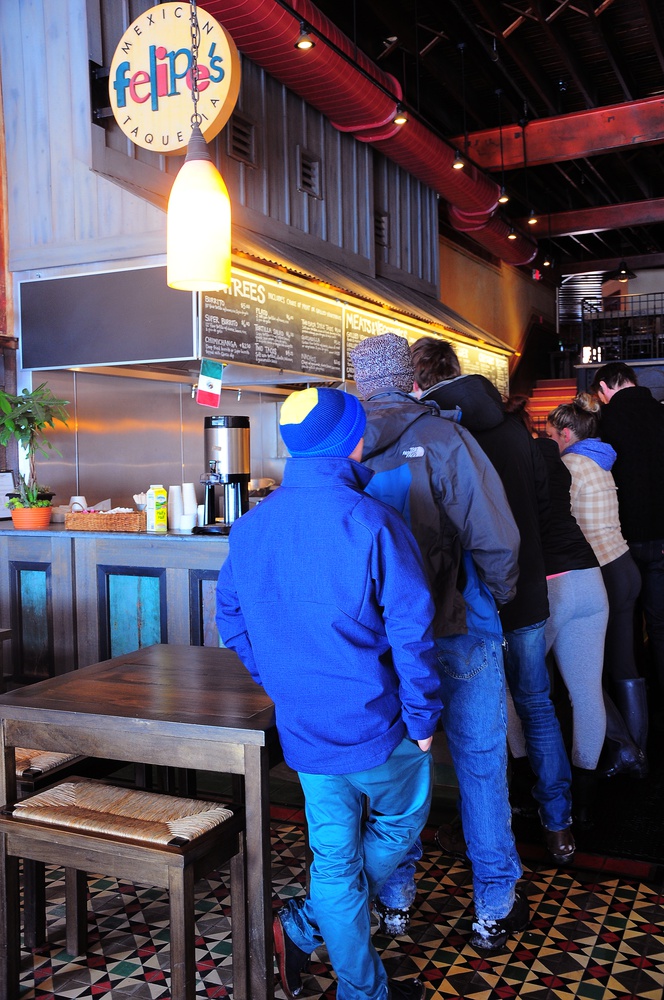 Hungry customers wait in line at Felipes's during the lunch rush on Sunday. Felipe's is known for its excellent authentic Mexican food and for its quick service.