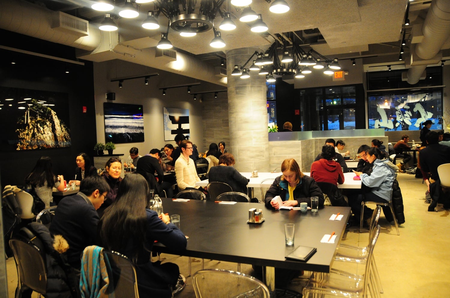 Customers enjoy freshly prepared ramen on a cold Tuesday evening. Santouka has experienced a rush of excited new customers who want to try out the newest eatery in Harvard Square.
