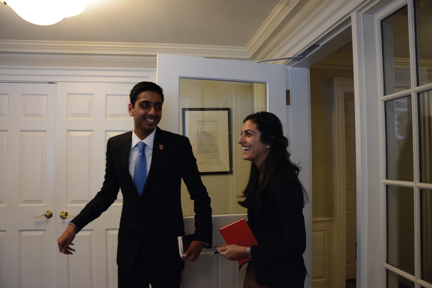 Undergraduate Council President Ava Nasrollahzadeh '16 and Vice President Dhruv P. Goyal '16 leave University President Drew G. Faust's office after meeting with her in Massachusetts Hall on Thursday afternoon. In the meeting, they discussed the UC's recent initiatives.