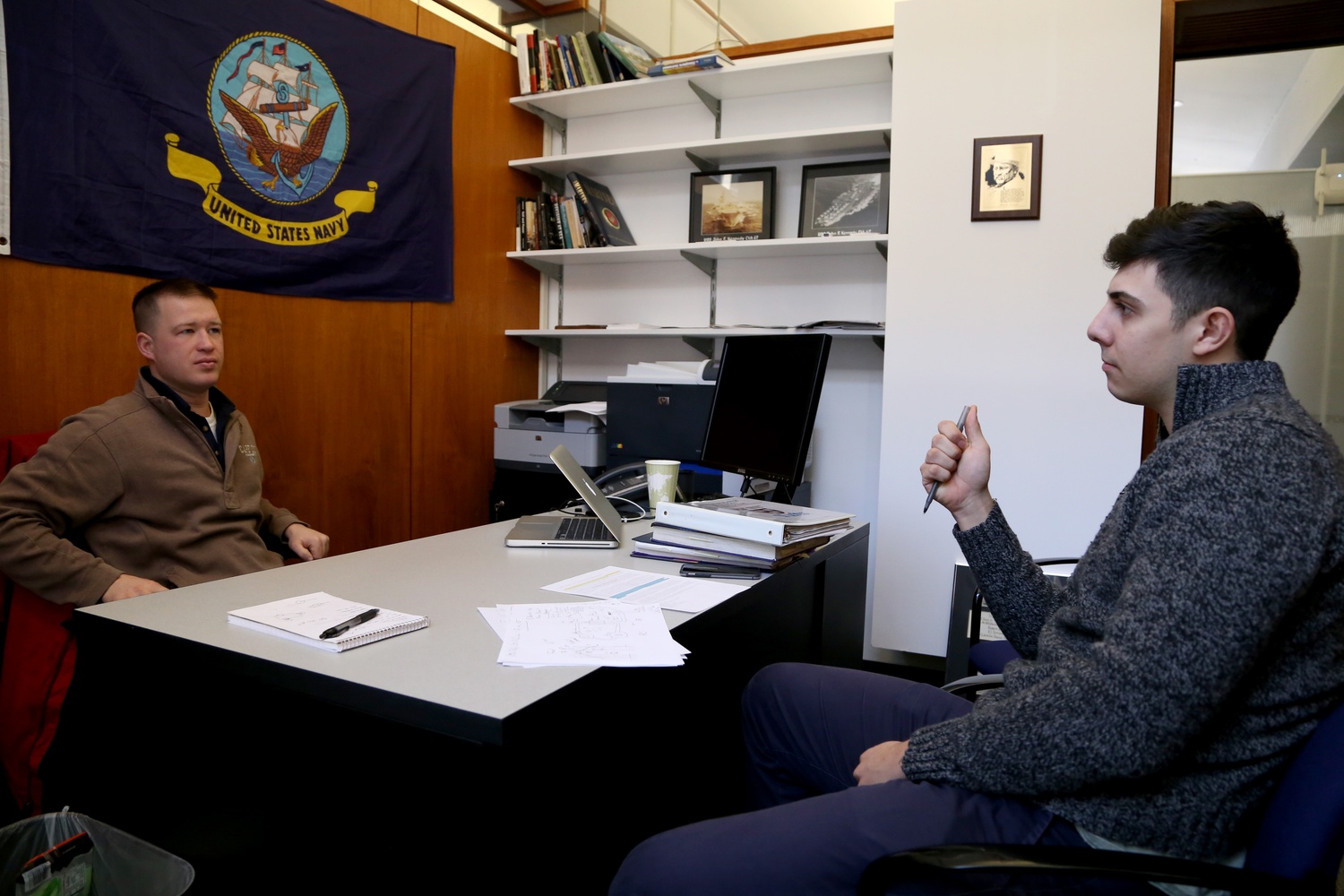 Lt. Nathan Stempel helps Sebastian R. Saldivar ’15 prepare for an interview in the SOCH.