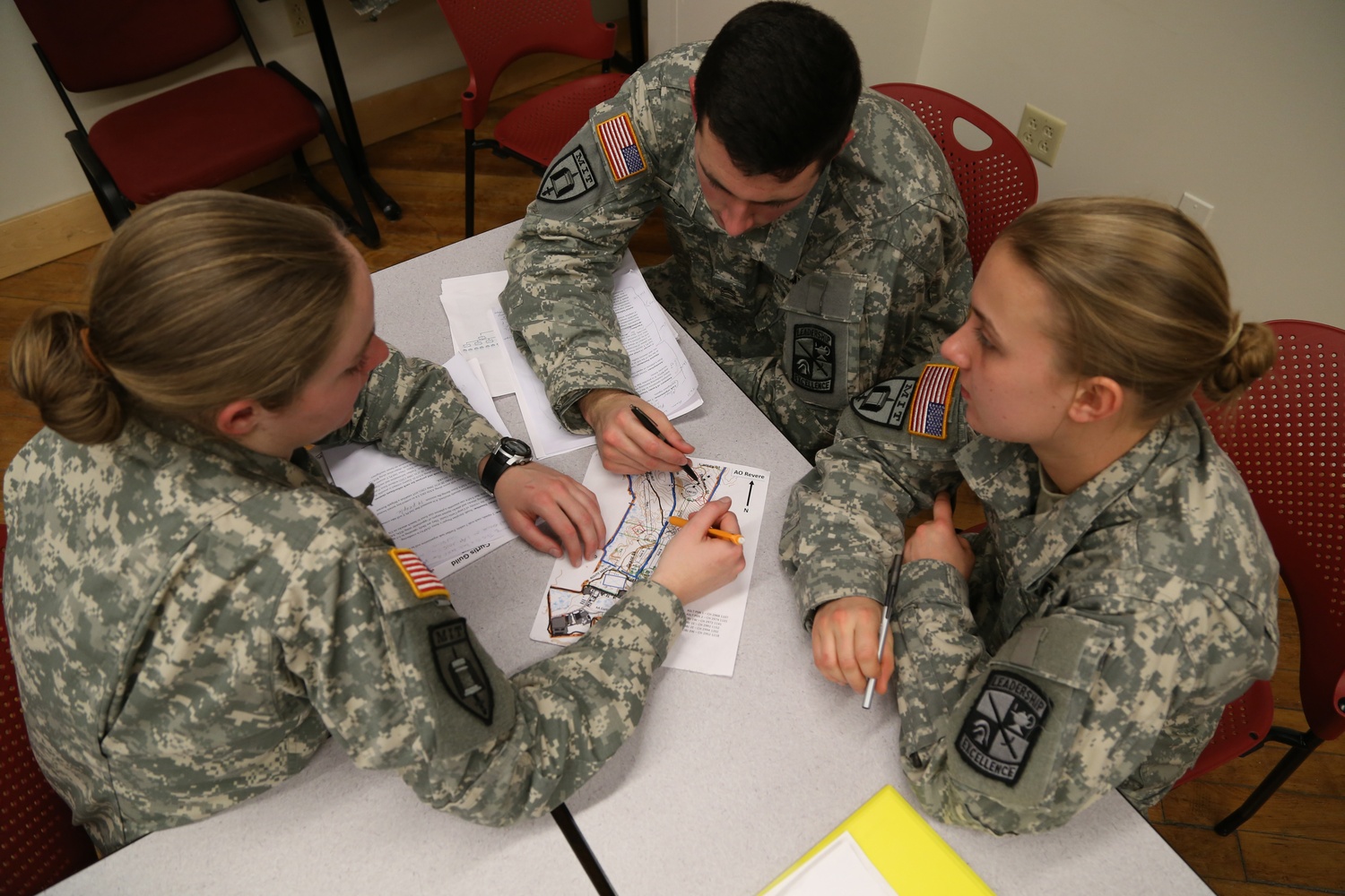 Charley M. Falletta ’16, Lucy F. Perkins, and James J. W. Clarke ’16 discuss tactics during Army ROTC’s weekly leadership lab on Wednesday, Feb. 18.