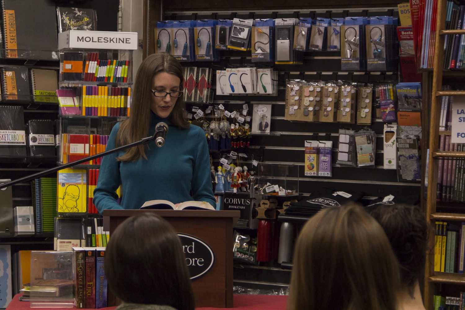 Kristin Cashore reads an excerpt from her book Fire at the Harvard Book Store Tuesday evening. Marie K. Rutkoski, who was planned to read from The Winner's Crime, could not attend due to weather difficulties.

