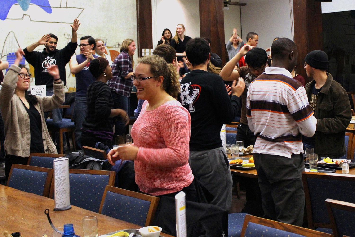 Singing and dancing in their dining hall, students in Quincy House produce their Housing Day video on Thursday evening. The production of Housing Day Videos, which advertise the benefits of each of the College’s 12 residential houses, is a tradition that involves dozens of students every year.