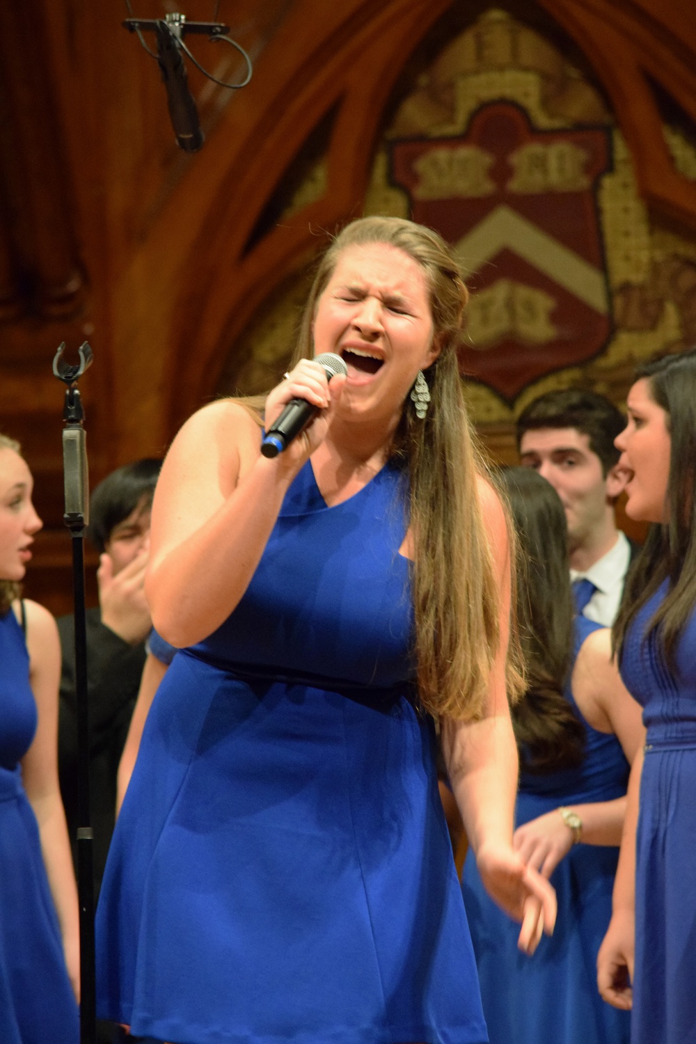 Lena K. Afeyan '17 of the Callbacks sings a solo in "Lips are Movin'" by Meghan Trainor Saturday night. The Callbacks and the Din & Tonics hosted a joint a capella jam entitled "Callbacks SnoweDin."