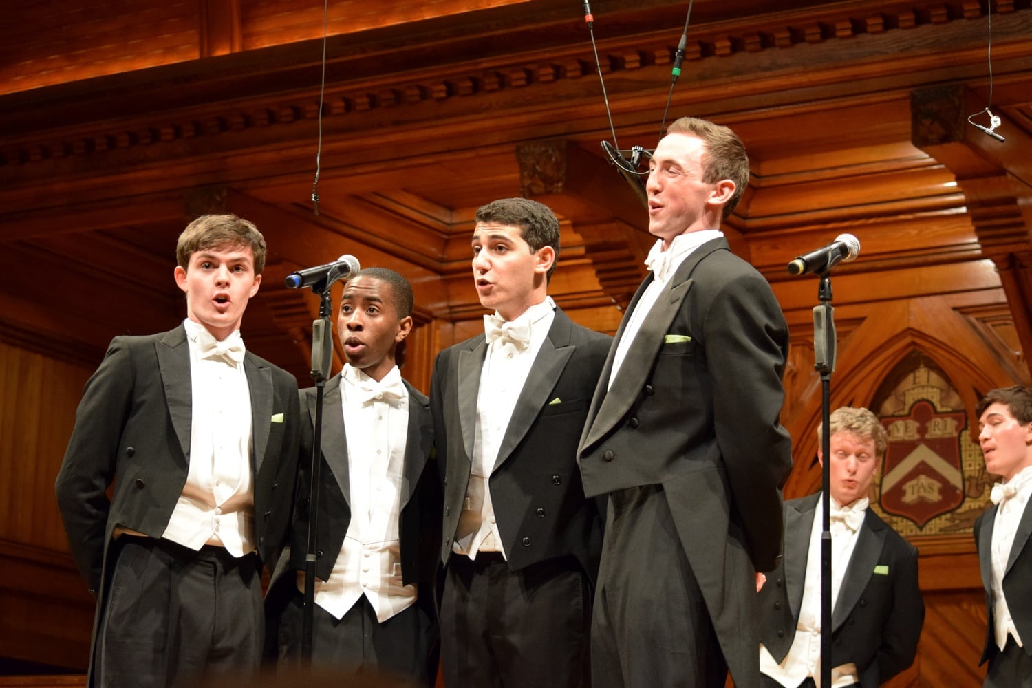 Matthew T. Barber '16, Sydney T. S. Mukasa '18, Jacques Berguig, and Will Jaroszewicz '17 of the Din & Tonics sing in a 2015 performance in Sanders Theatre.