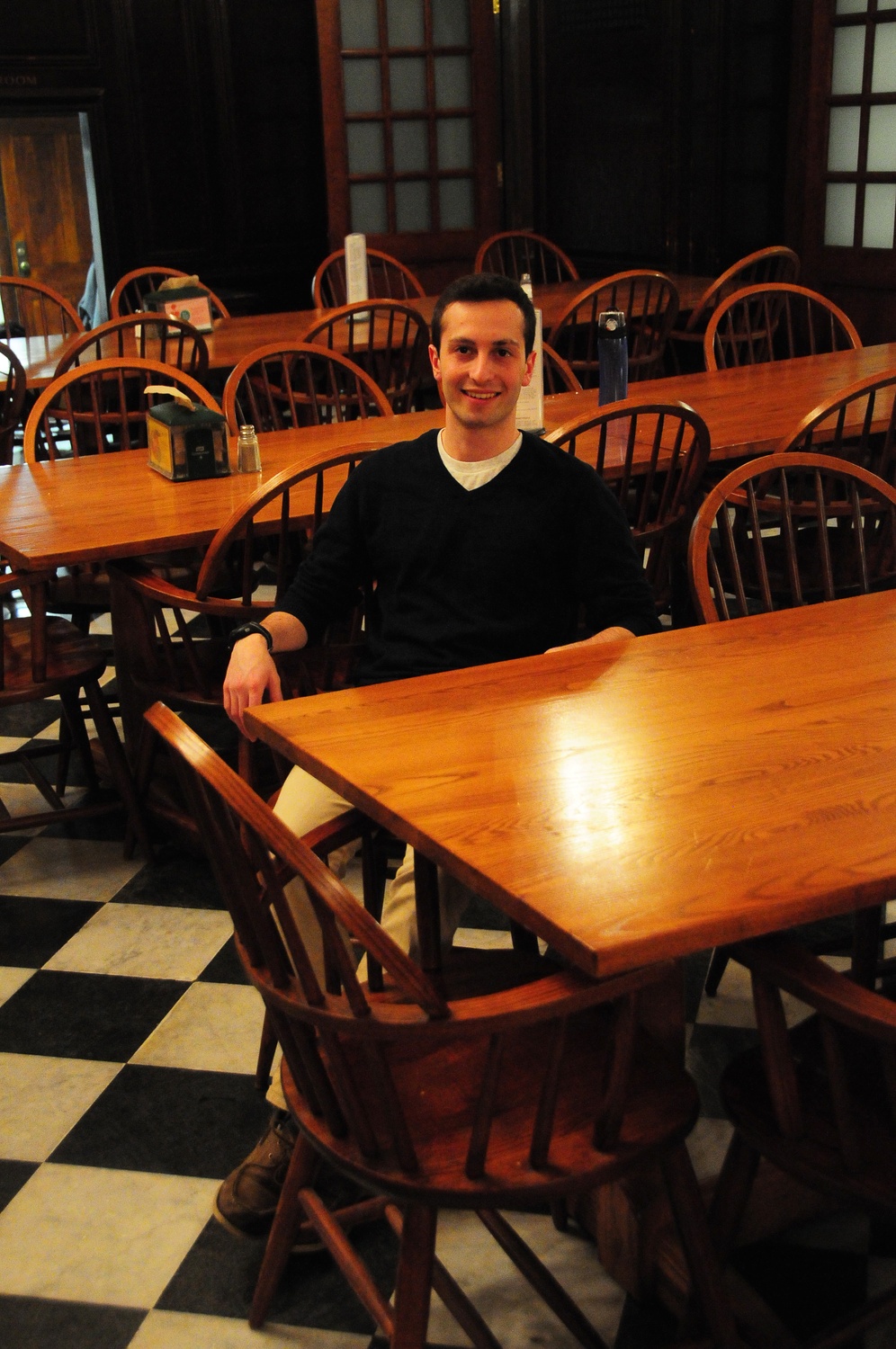 Jacob R. Carrel '16, president of the Harvard College Democrats, relaxes in Winthrop House dining hall on Monday night. Carrel is one of many students trying to balance House life and extracurricular obligations.
