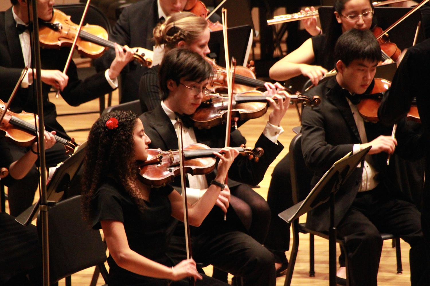 Concertmistress Theresa C. Rizk '17 (left) and the violin section performs with the rest of the Bach Society Orchestra on a Saturday night.