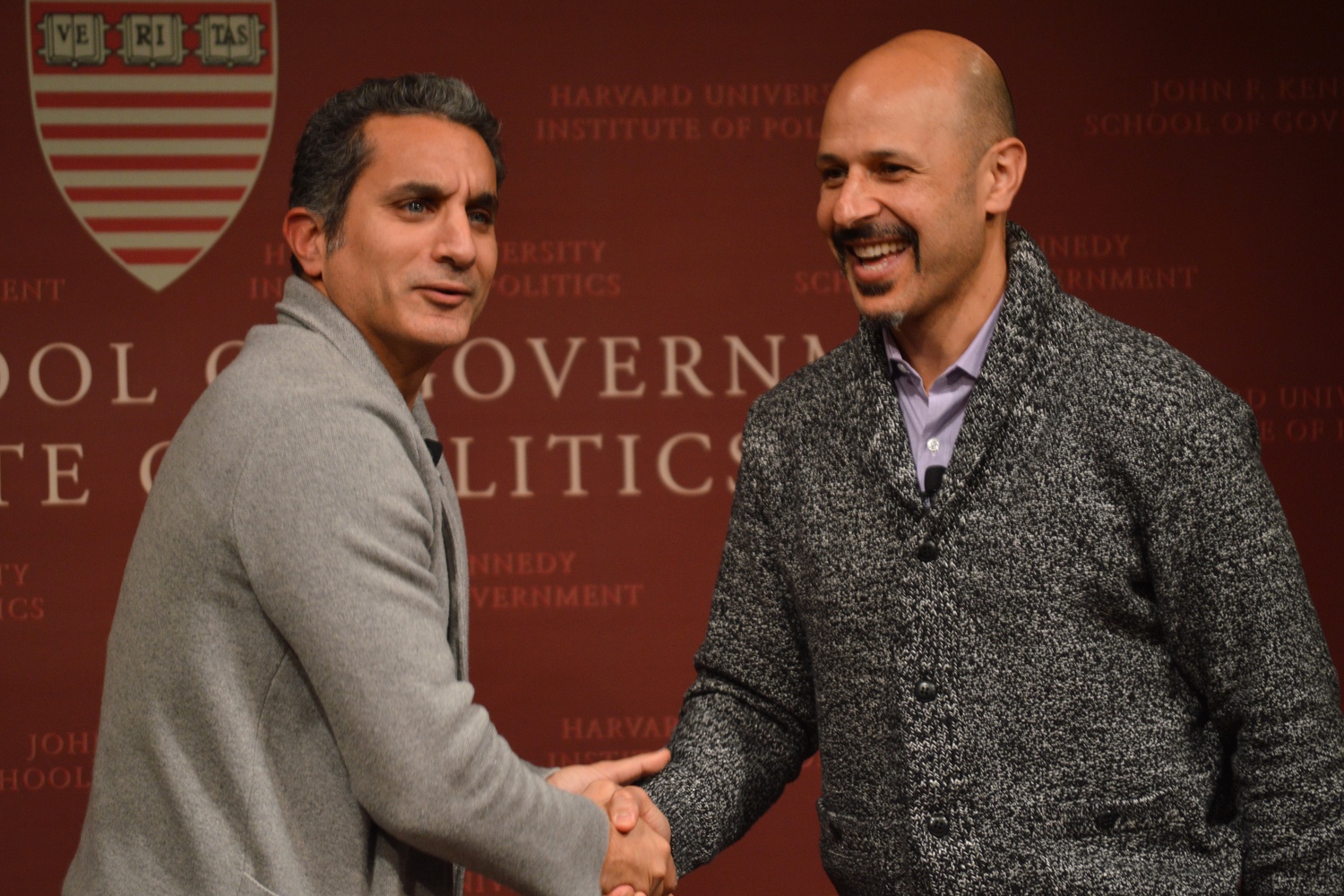 At the end of a forum discussion featuring comedians rather than politicians, Bassem R.Youssef, left, extends a concluding handshake to actor and fellow comedian Maz Jobrani. 
