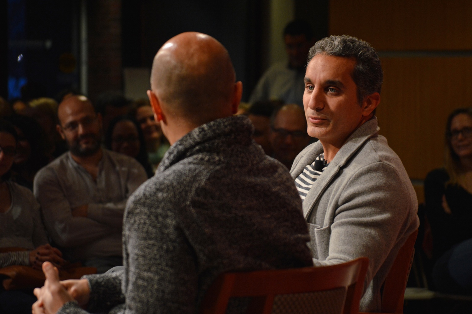 Bassem R.Youssef, a well-known Egyptian comedian, listens to Maziyar Jobrani, an Iranian-American actor and comedian. In a forum about political humor, the two exchanged jokes as well as commentary on contemporary events.
