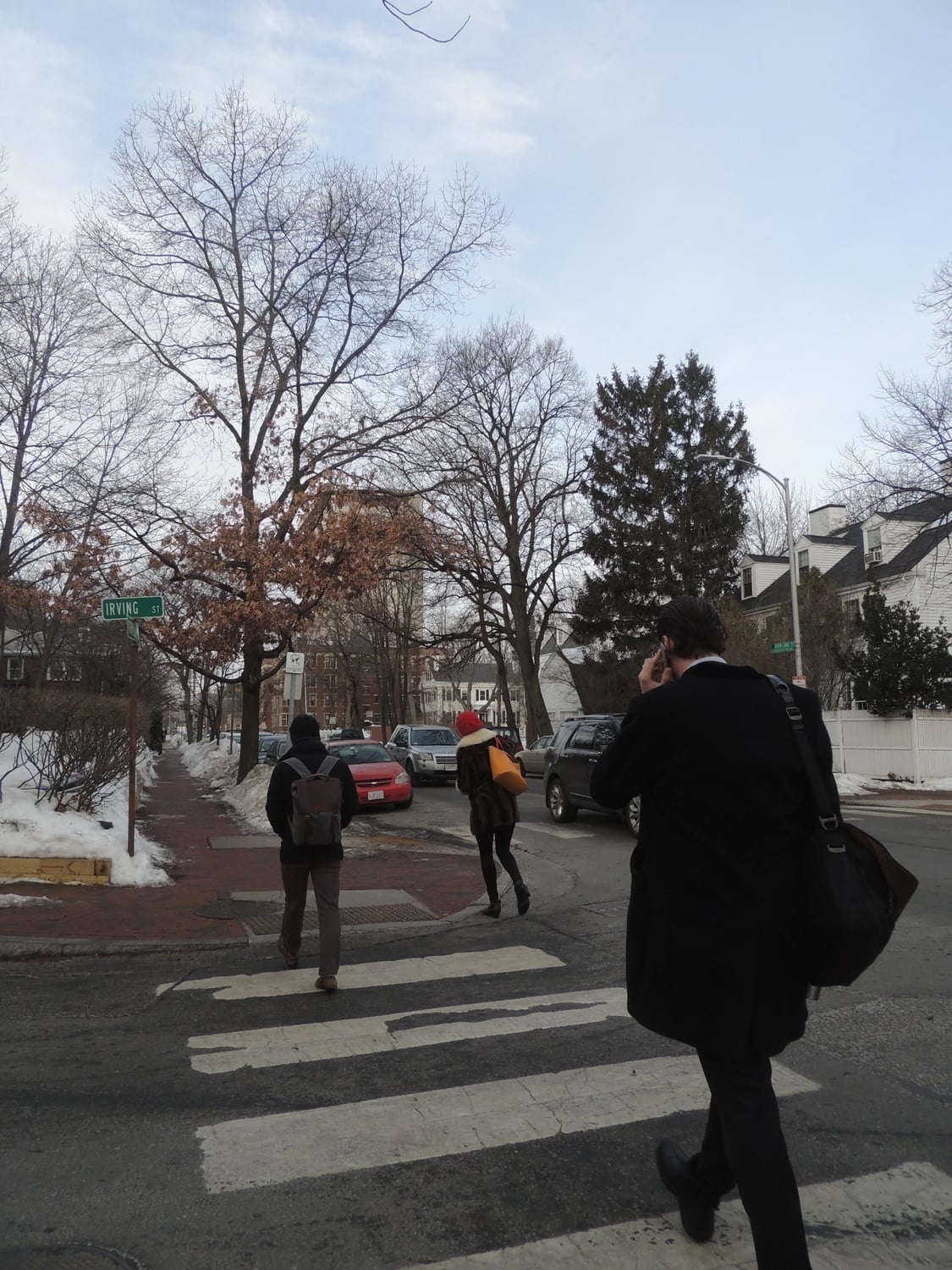 Assistant professor of government Ryan D. Enos walks down Kirkland Street to his office in the CGIS Knafel buidling from his home a few blocks away.