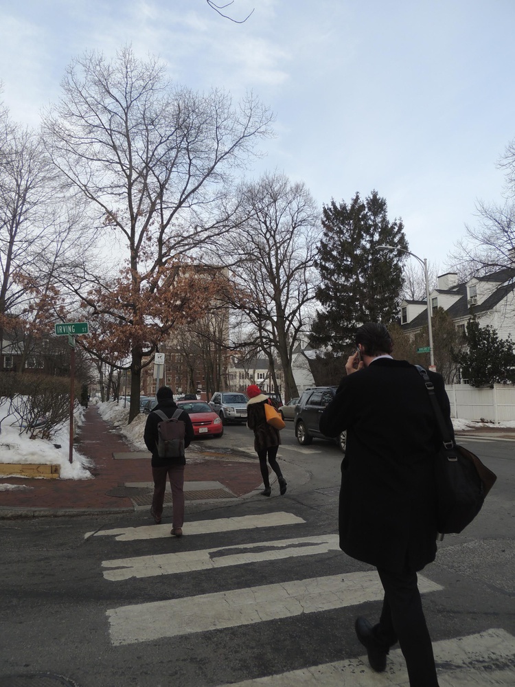Assistant professor of government Ryan D. Enos walks down Kirkland Street to his office in the CGIS Knafel buidling from his home a few blocks away.