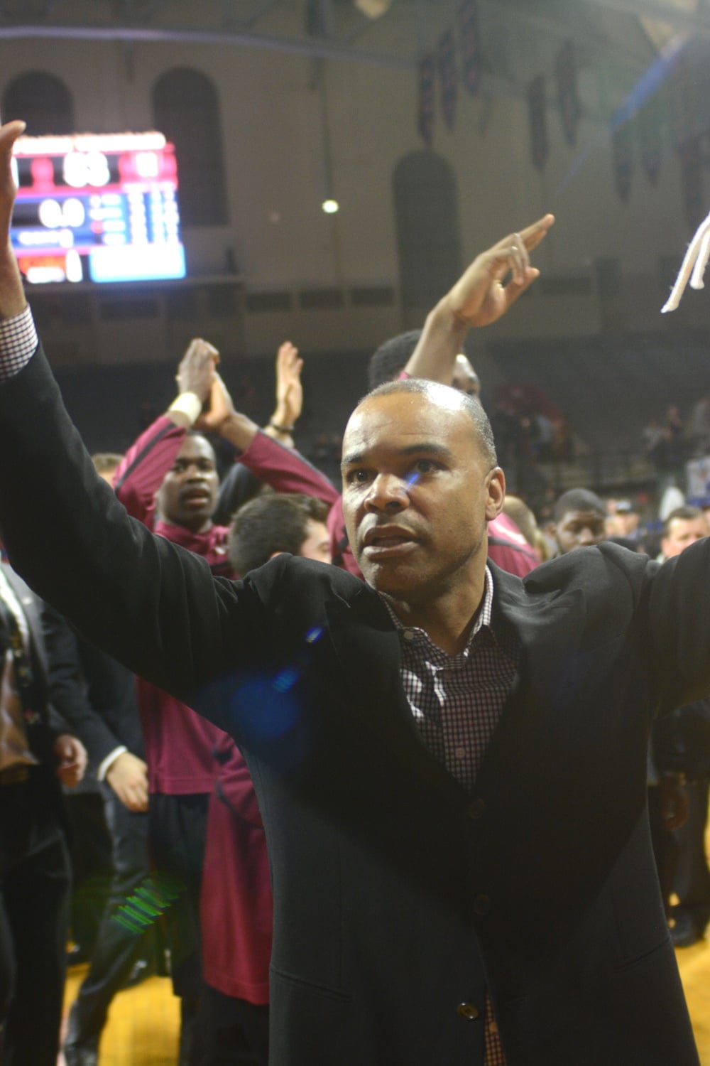 Harvard coach Tommy Amaker and his Crimson team earned their fourth-consecutive NCAA Tournament berth after beating Yale on a last-minute basket from co-captain Steve Moundou-Missi.