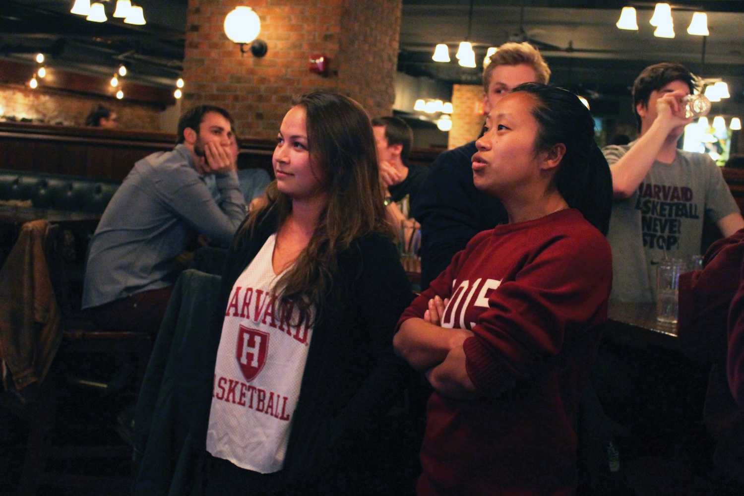 Harvard basketball fans watch the final moments of the Harvard vs. UNC game on Thursday at John Harvard's.