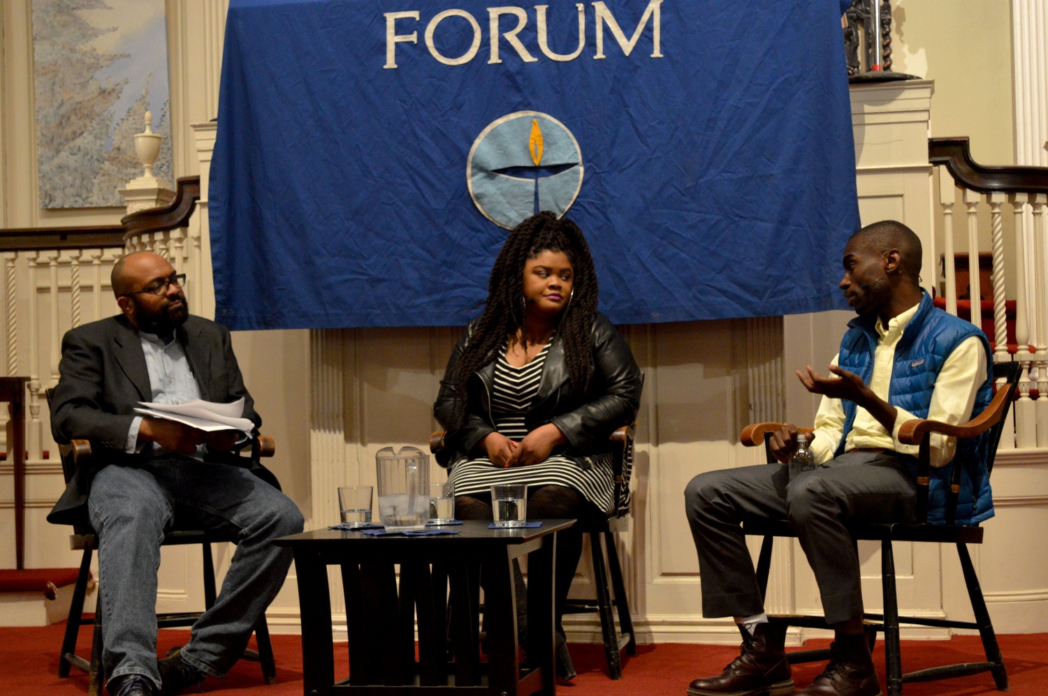 Jabari Asim moderates a conversation with Ferguson activists and bloggers Johnetta Elzie and DeRay McKesson at a Cambridge Forum event. Elzie and McKesson both received the 2015 Howard Zinn Freedom to Write award for their work during the protests in Ferguson, Mo.
