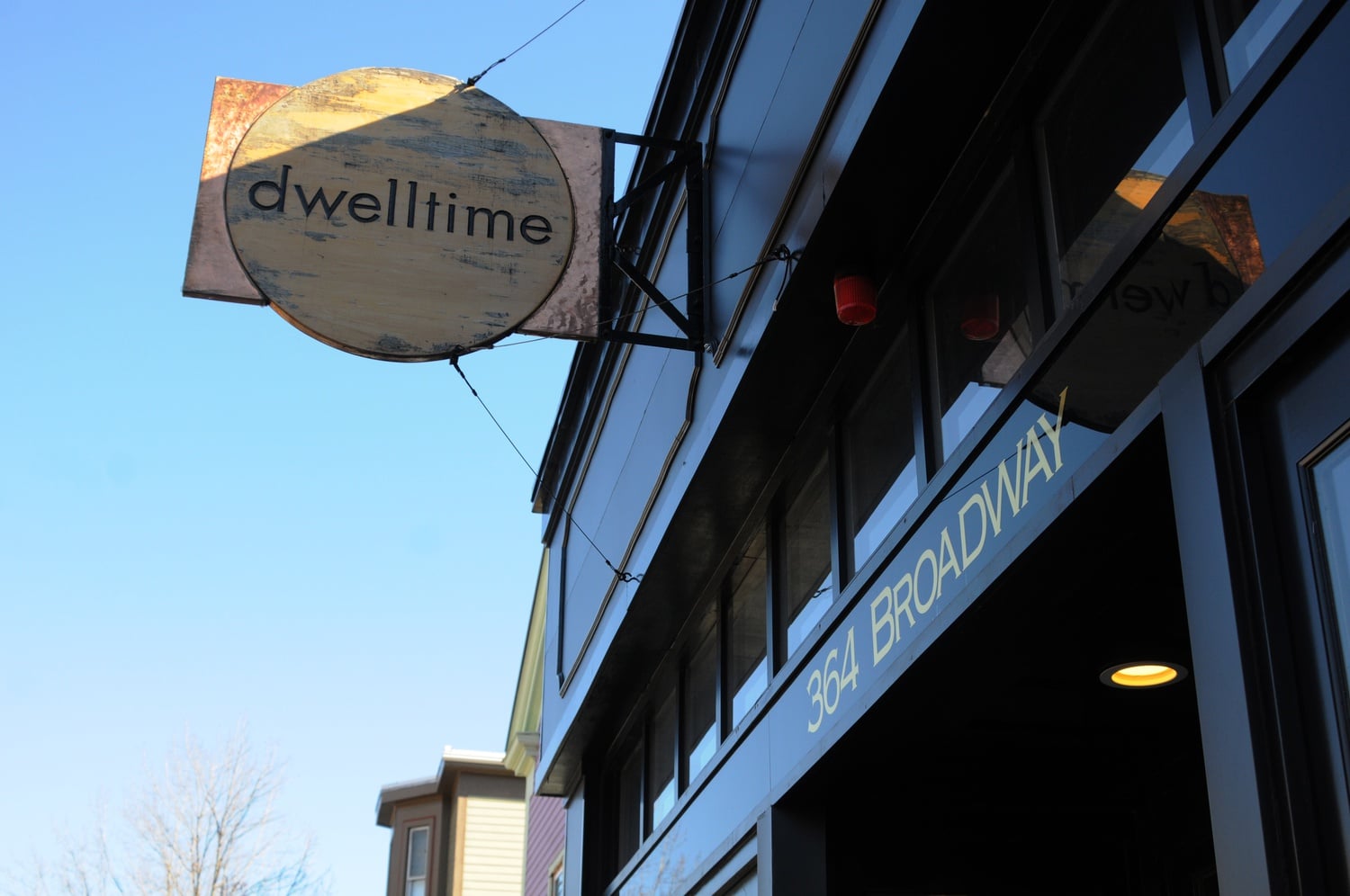 The sign of Dwelltime, located on Broadway in Cambridge, welcomes you into the store.  