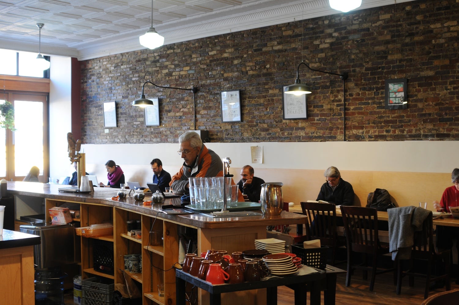 On a Thursday afternoon, many people sit, relax, and enjoy their coffee in Dwelltime's space.  