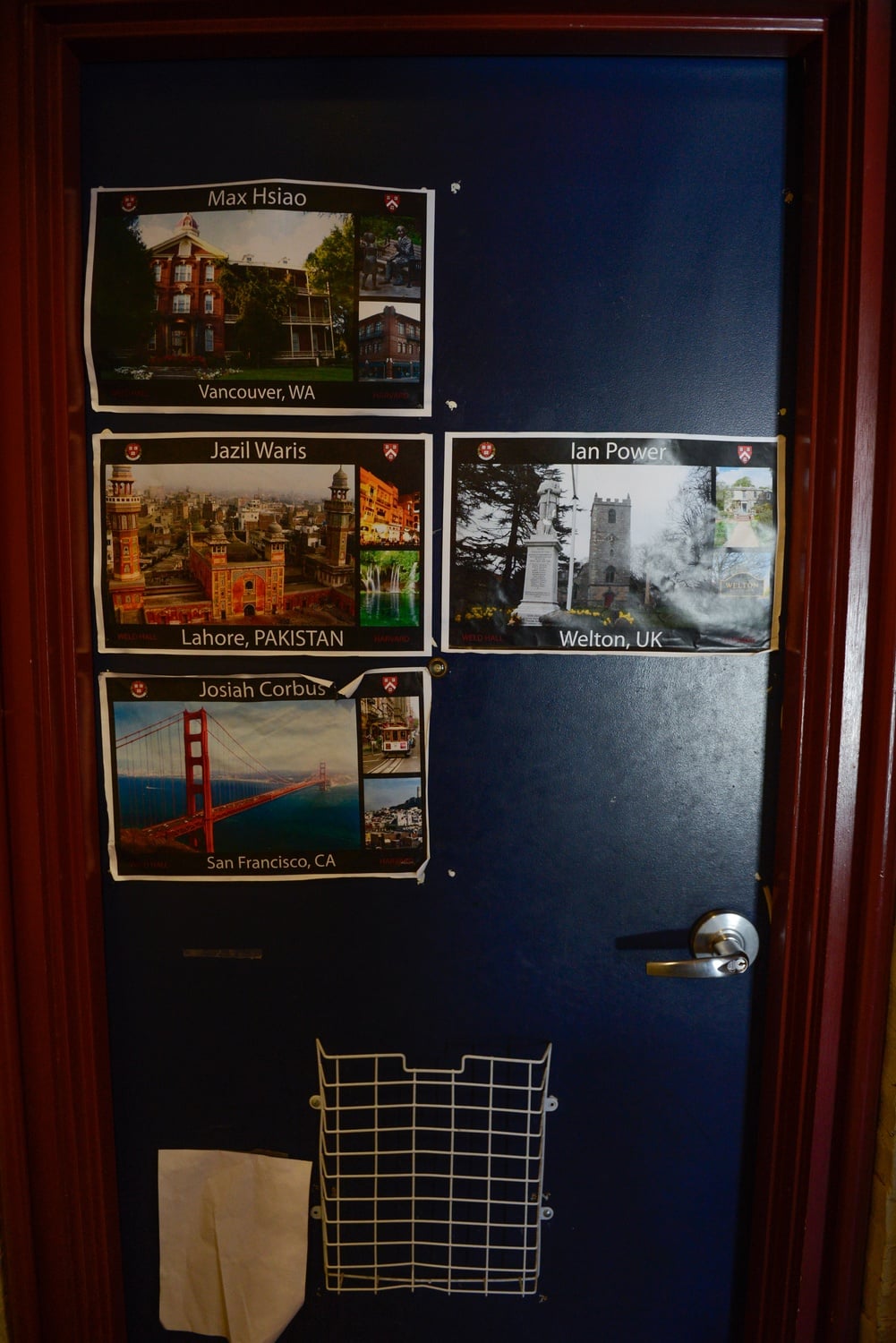 Doors in freshman dorm Weld Hall are decorated with pictures of students' hometowns. The Freshman Deans Office says geographic diversity factors into rooming assignments.