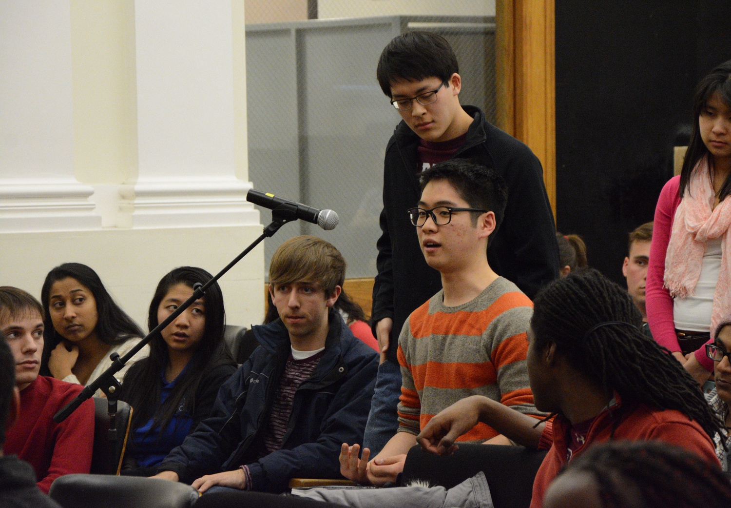 College student Kunho Kim '17 speaks to President Faust and Dean Khurana about the lack of accessibility for disabled students on campus. Kim was one of many students to voice concerns about true inclusion for all members of the Harvard community during the forum.