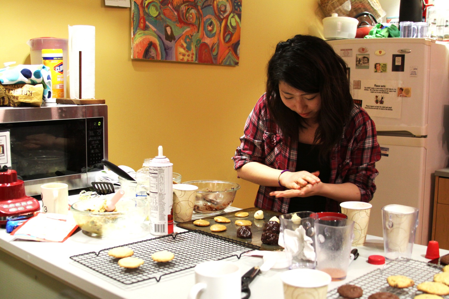 Esther Jeon '18 rolls cookie dough at the Wellness Study Break on Thursday evening. Students flowed into the Harvard College Women’s Center to drink smoothies and receive massages from Stressbusters.