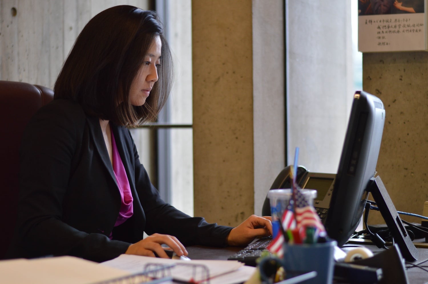 Michelle Wu ‘07, the first Boston City Councilor to give birth while in office, works at her desk in Boston City Hall at noon on March 30. 
