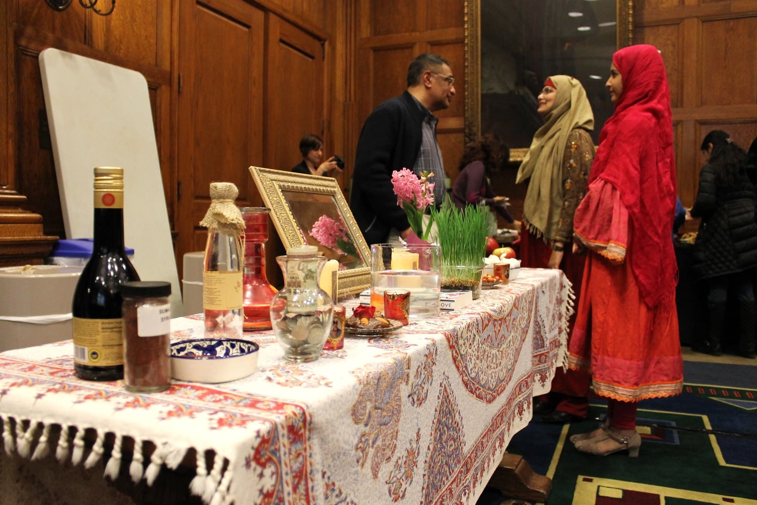 Faculty members and students come together to celebrate the Persian New Year and beginning of spring at the annual Nowruz celebration in 2015.