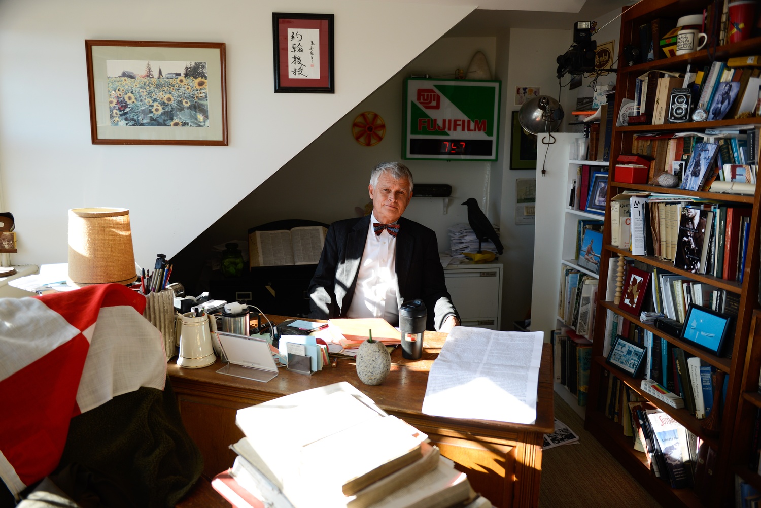 Stilgoe poses in his office on the top floor of Sever Hall. Students frequently drop by for office hours.