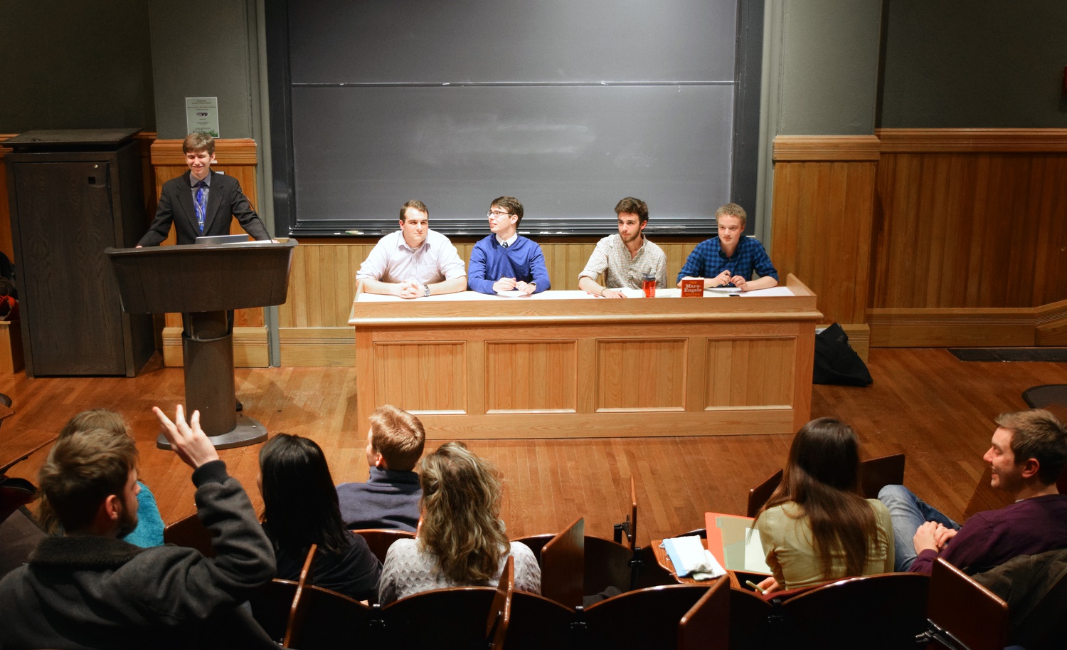 Students sit on a panel during an undergraduate debated entitled, “Is Capitalism Good?” The Harvard Political Union hosted the event in Sever Hall Wednesday evening.