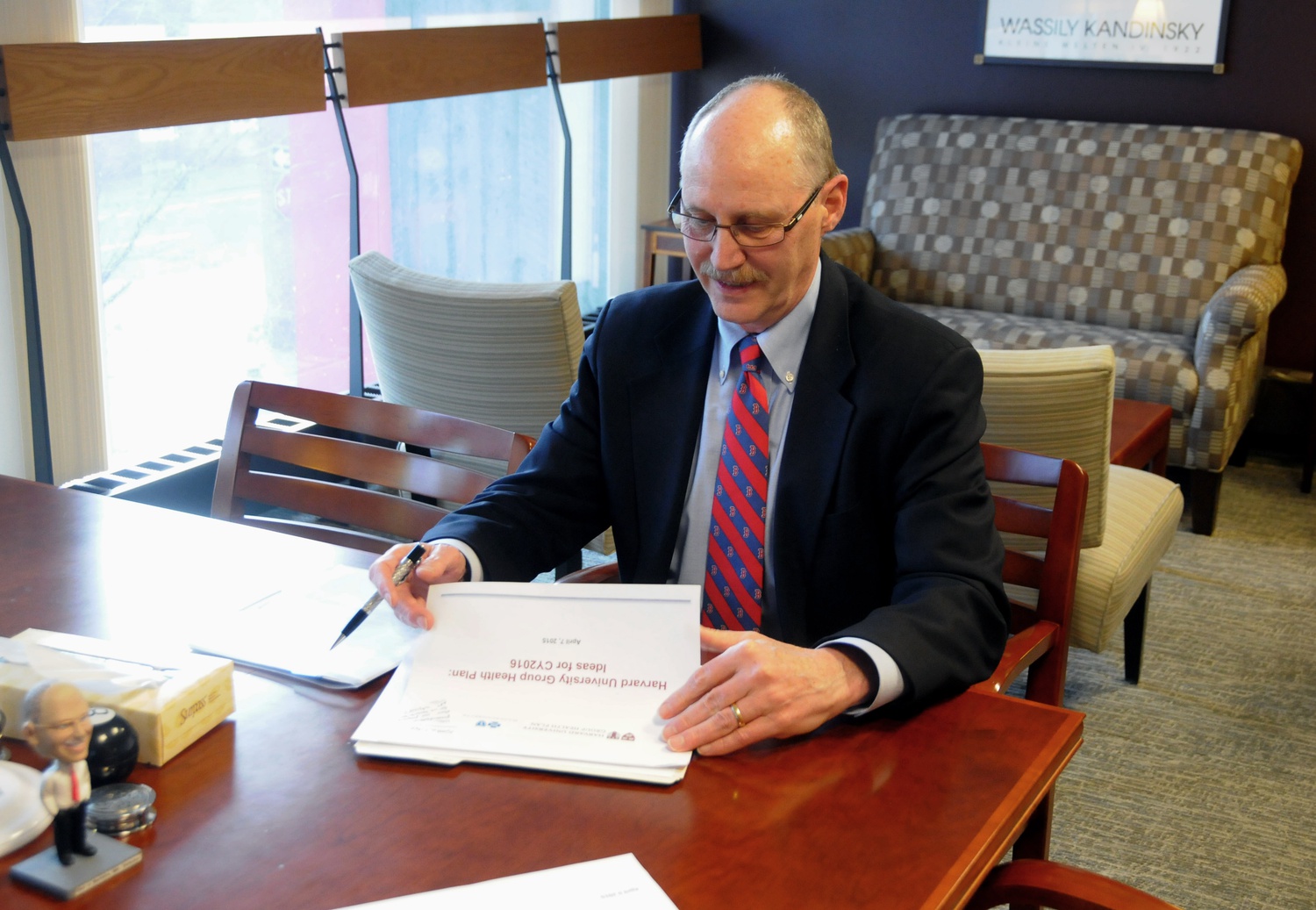 Dr. Paul J. Barreira, director of Harvard University Health Services, provides a brief overview of the Bureau of Study Counsel change from HUHS to Harvard College on Monday evening in his office.  