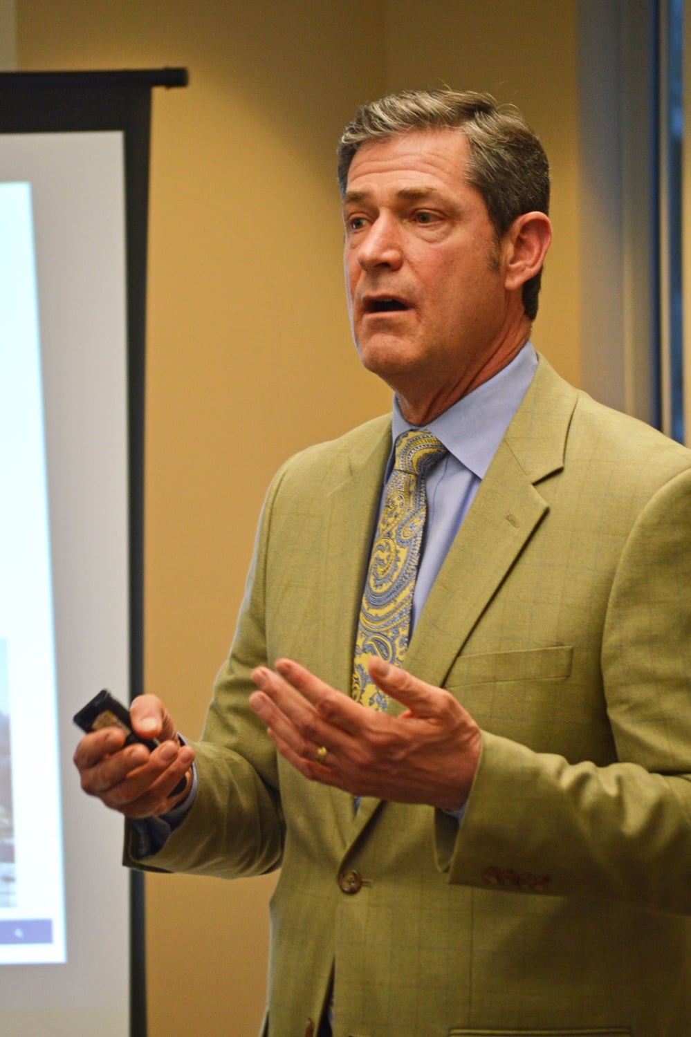 Harvard Associate Vice President for Public Affairs and Communications Kevin Casey speaks during the first meeting of the Harvard-Allston Task Force in over 100 days.