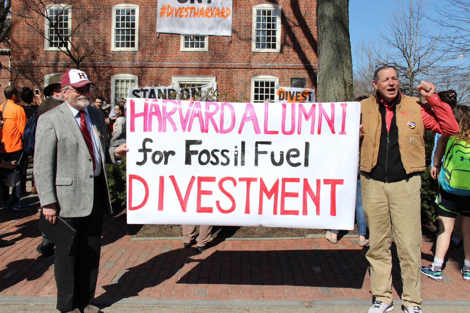 Donald M. Hooper ’68 and C. “Al” Boright '68, President of the Harvard-Radcliffe Club of Vermont, hold a banner calling for University divestment from fossil fuels. Hooper and Boright took part in a rally held Monday morning as part of "Harvard Heat Week."