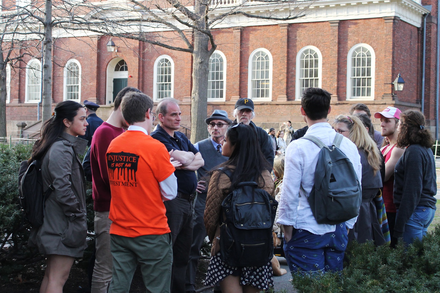 Several protesters have a debrief after University President Drew G. Faust held a climate panel on the same day that Divest Harvard kicks off “Harvard Heat Week.” 
