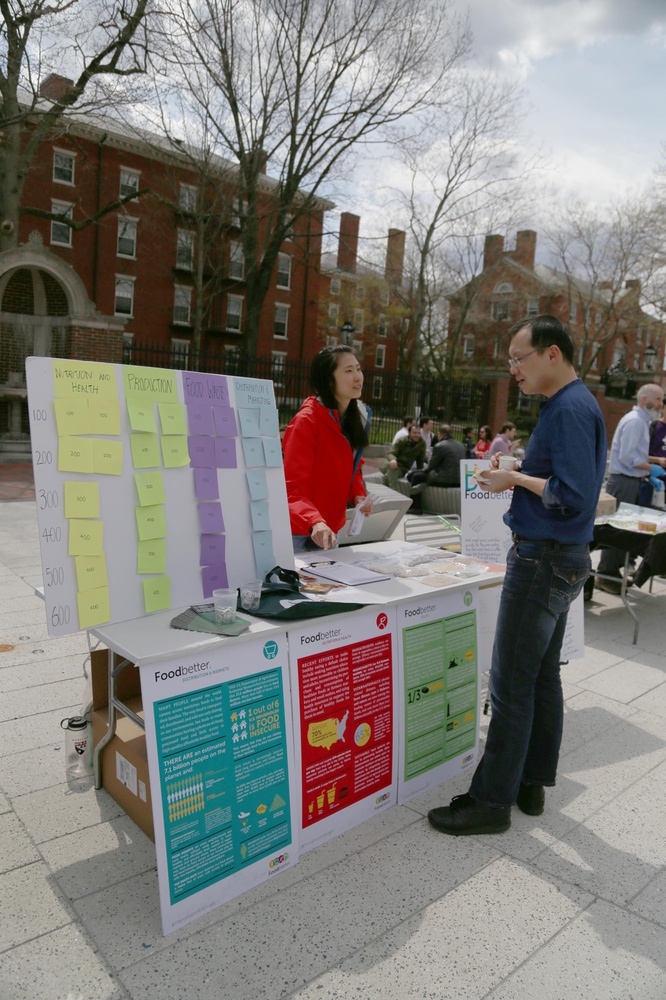 Claire T. Lo ’16, left, a Winthrop Food Literacy fellow, has FAS SEAS postdoctoral fellow Xianming Zhang, right, name grains at the Harvard Sustainability Fair on Wednesday afternoon.