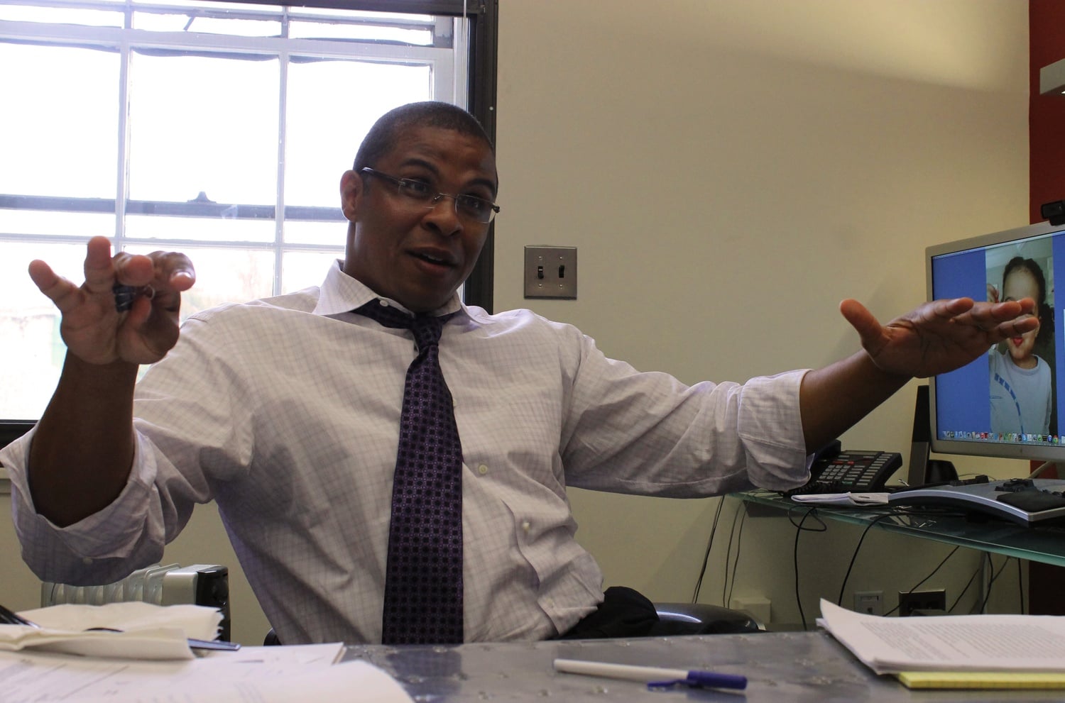 Roland G. Fryer, this year’s John Bates Clark Medal recipient, speaks about his research on education for disadvantaged youths, influential mentors, and his two-year-old daughter on Monday afternoon in his office at Littauer Center. 